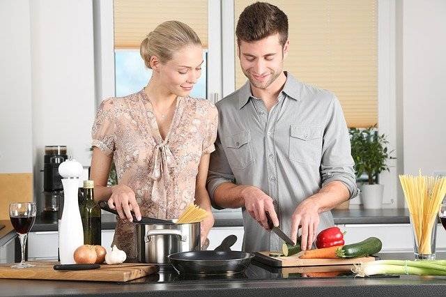 A woman preparing the best food his man likes. Picture of how to please a man.