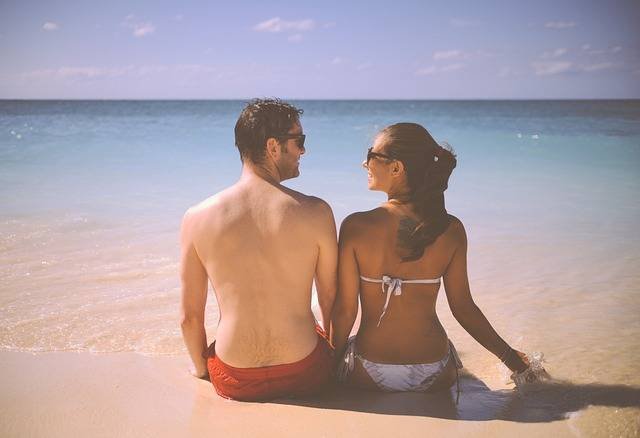 a guy and a girl in a beach