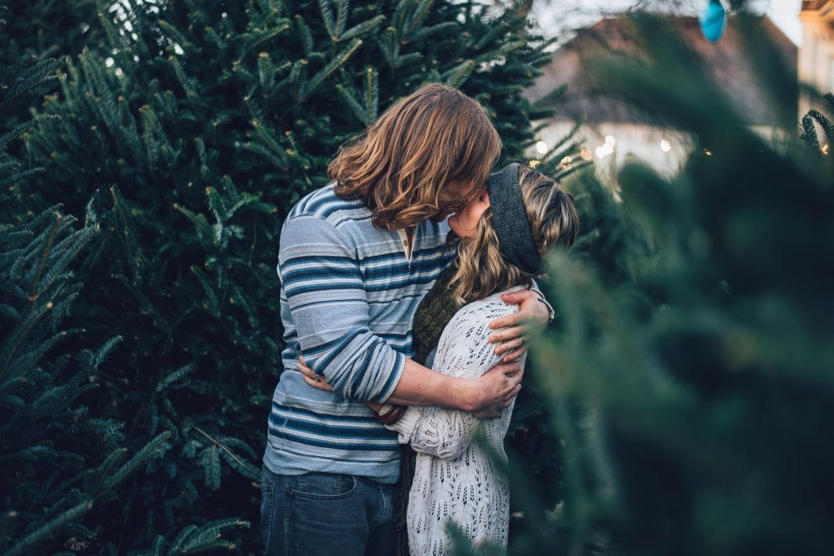A guy kissing a girl