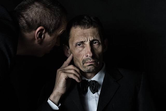 A man listening while someone is talking
