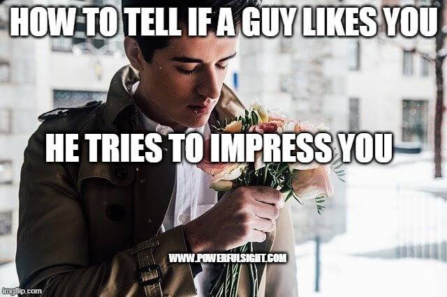 A guy holding a flower