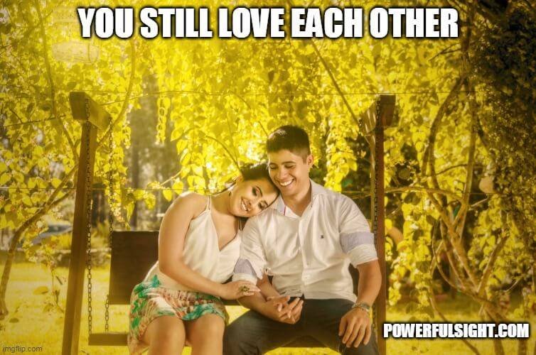 Two lovers sitting on a swing showing signs you and your ex are meant to be